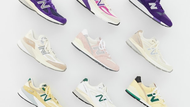 View of nine multicolor New Balance sneakers.